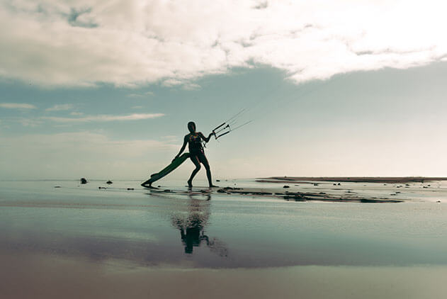 Student returning to shore after a long kiteboarding session