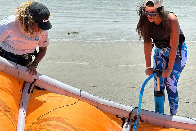 Instructor teaching a student how to assemble the equipment